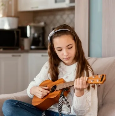 girl playing guitar