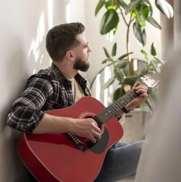 man playing guitar