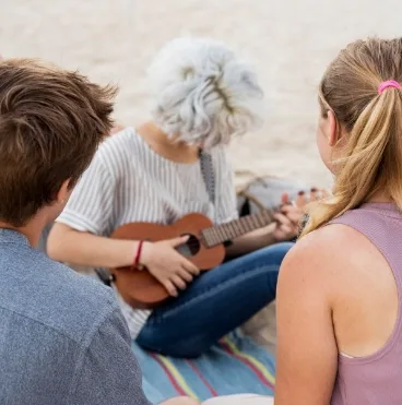 old lady playing guitar